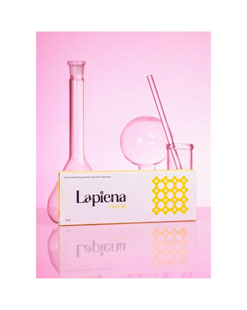 Pink glass science bottles and accessories with 'Lapiena' Classic  on a pink background